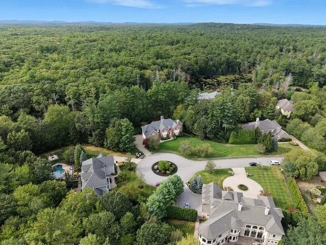 an aerial view of a house with outdoor space