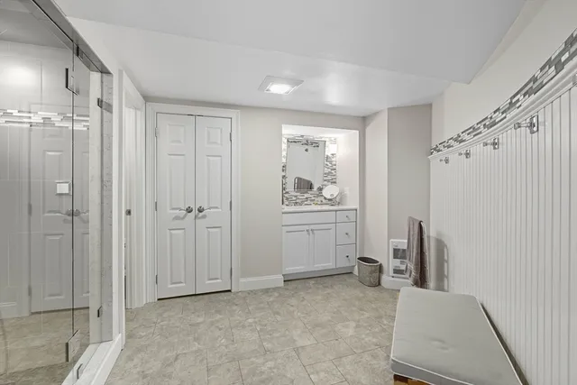 a view of a hallway with closet and entryway