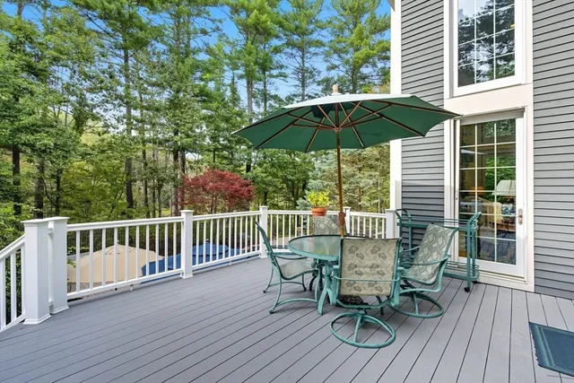 a view of balcony with furniture and wooden deck