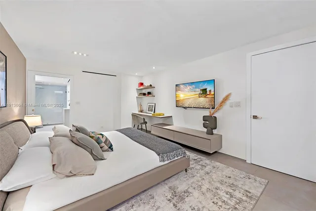 a view of a balcony with two chairs and a table