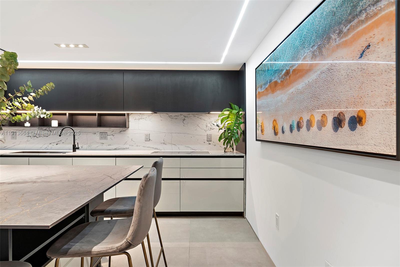 2301 Collins Avenue, Unit 1004 Miami Beach, FL 33139 - Photo 27 of 53 a kitchen with a sink and a stove