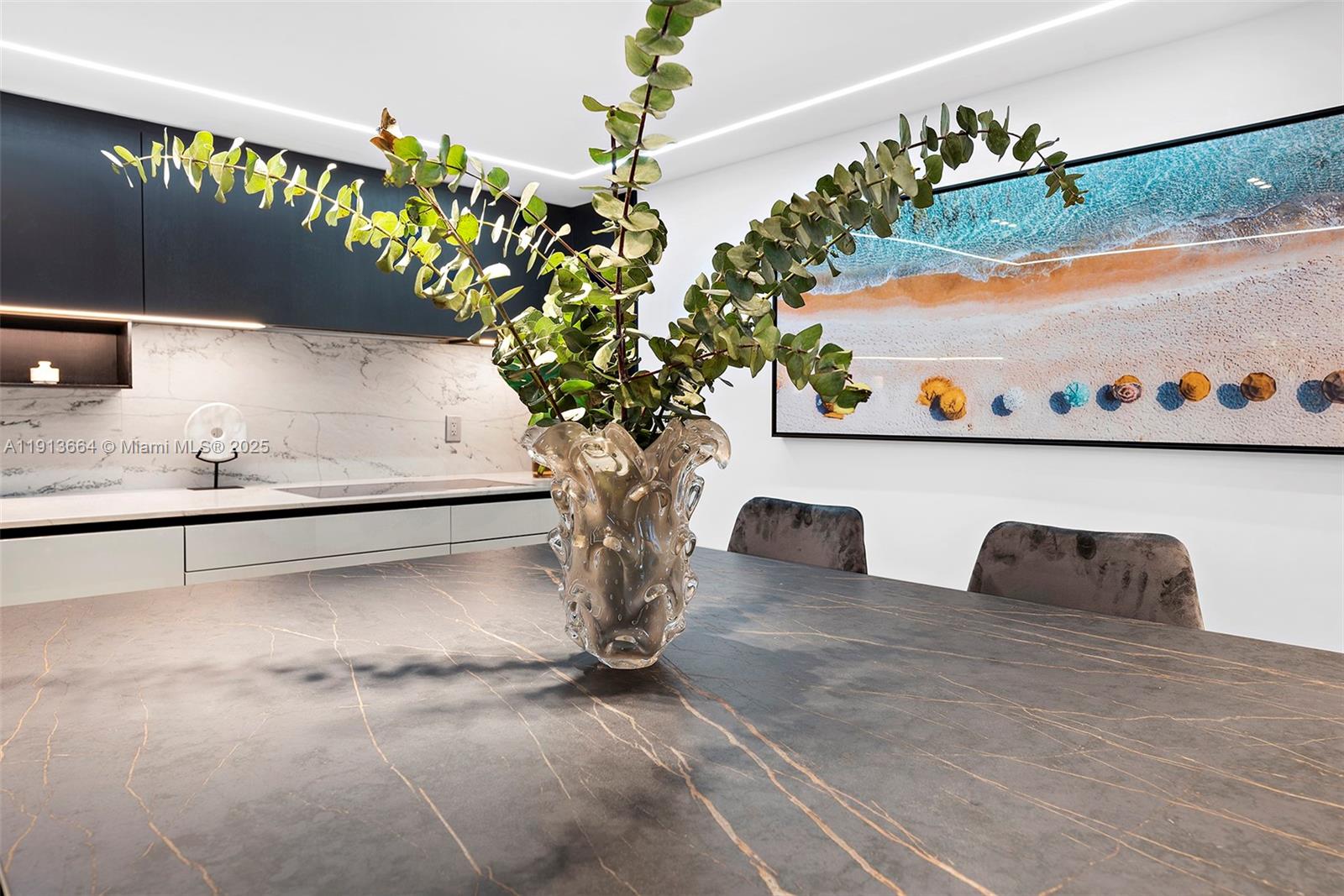 2301 Collins Avenue, Unit 1004 Miami Beach, FL 33139 - Photo 29 of 53 a vase of flowers sitting on a table