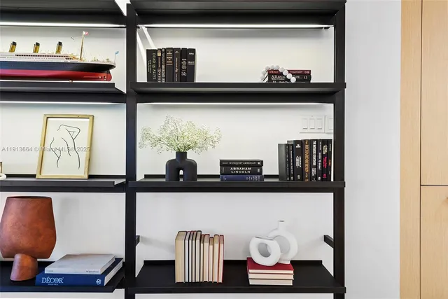 a dining room with furniture and a potted plant