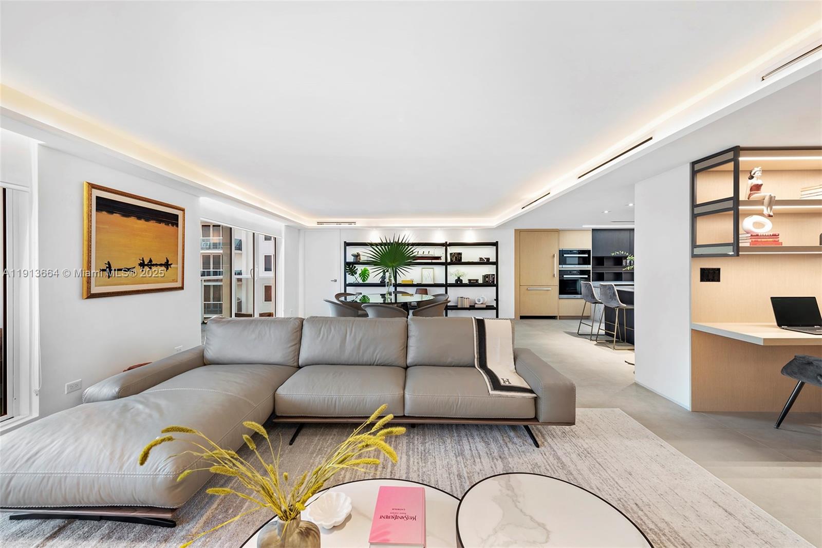 2301 Collins Avenue, Unit 1004 Miami Beach, FL 33139 - Photo 37 of 53 a living room with furniture and view of kitchen