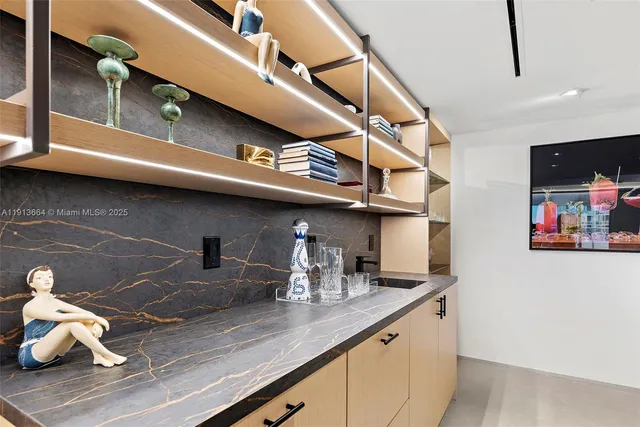 a kitchen with a sink a stove and a microwave