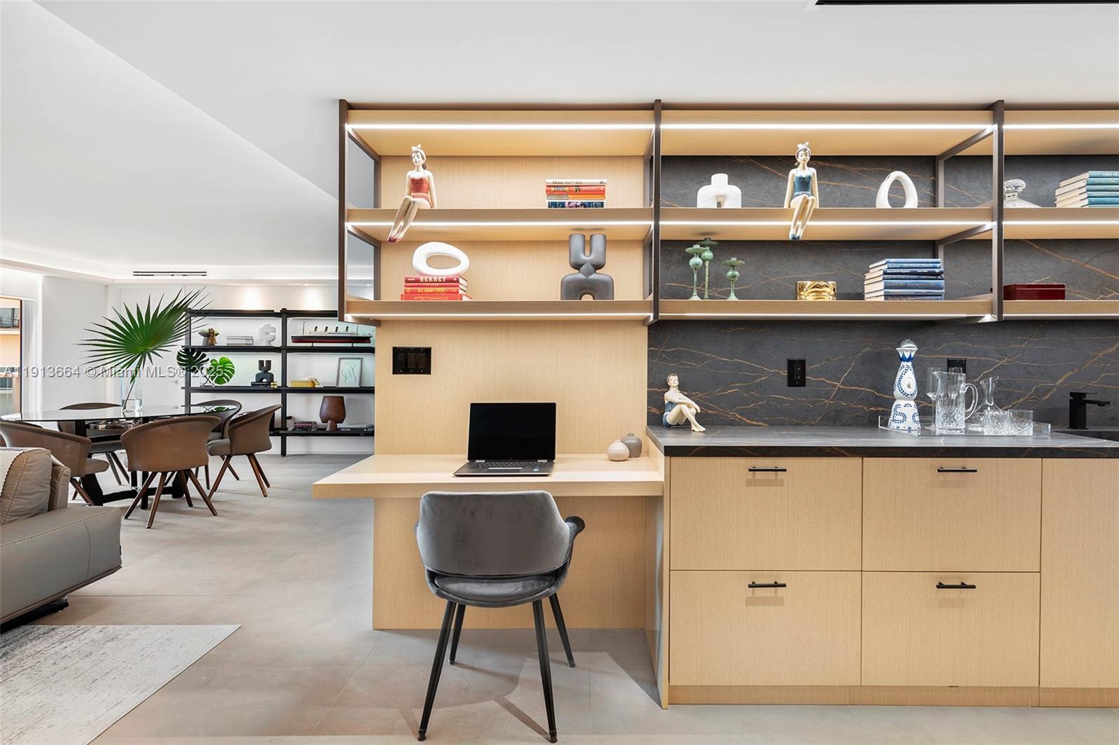 2301 Collins Avenue, Unit 1004 Miami Beach, FL 33139 - Photo 40 of 53 a kitchen with a sink a stove and a microwave
