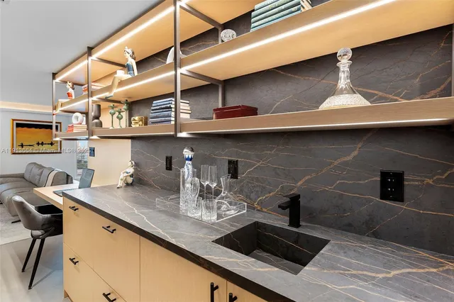 a kitchen with a table and chair