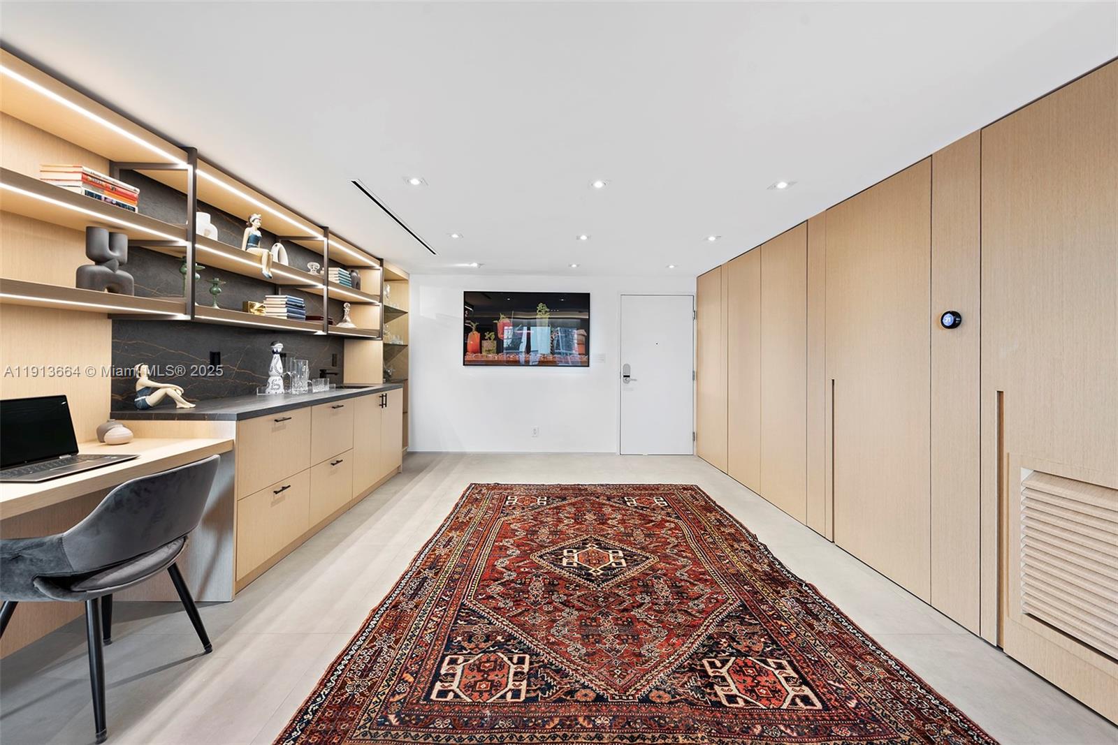 2301 Collins Avenue, Unit 1004 Miami Beach, FL 33139 - Photo 51 of 53 a kitchen with stainless steel appliances granite countertop a refrigerator and a stove top oven