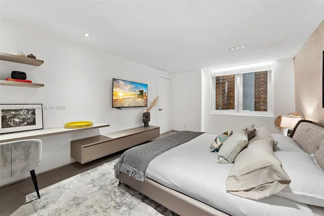 a kitchen with kitchen island a sink stove and refrigerator