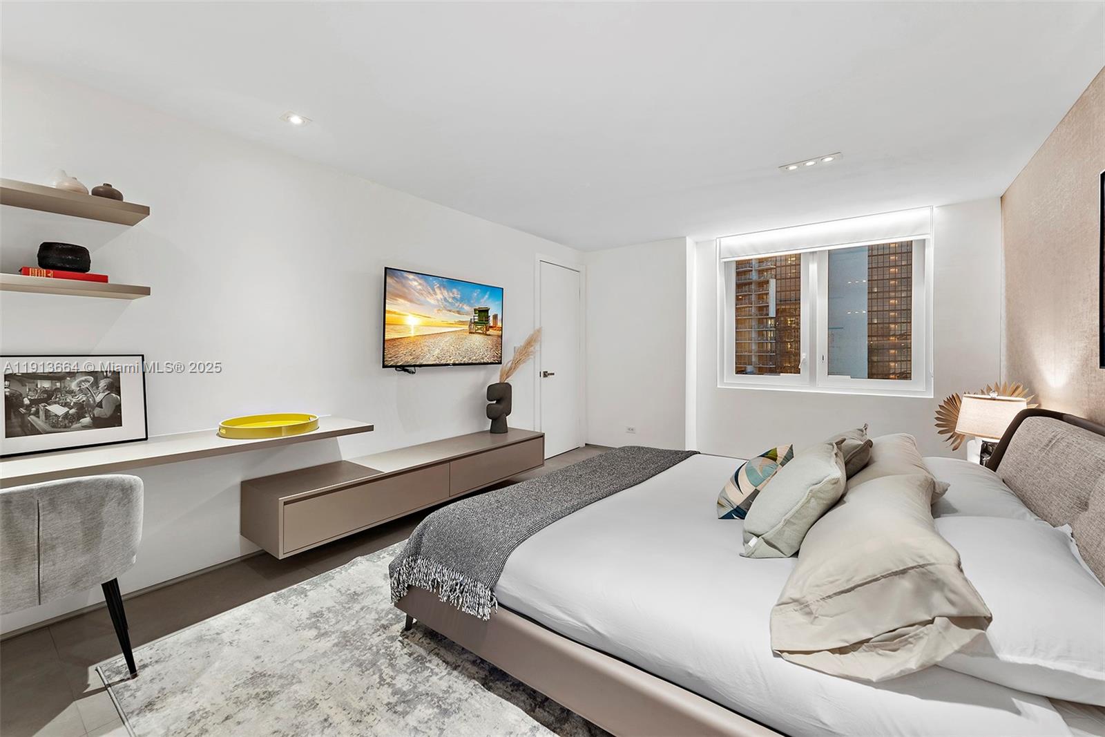 2301 Collins Avenue, Unit 1004 Miami Beach, FL 33139 - Photo 8 of 53 a bedroom with a bed and a dresser