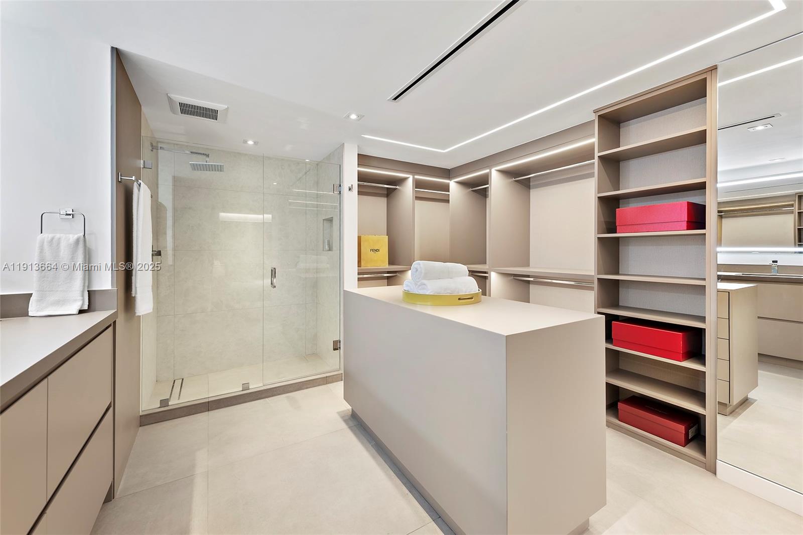 2301 Collins Avenue, Unit 1004 Miami Beach, FL 33139 - Photo 9 of 53 a kitchen with kitchen island a sink stove and refrigerator