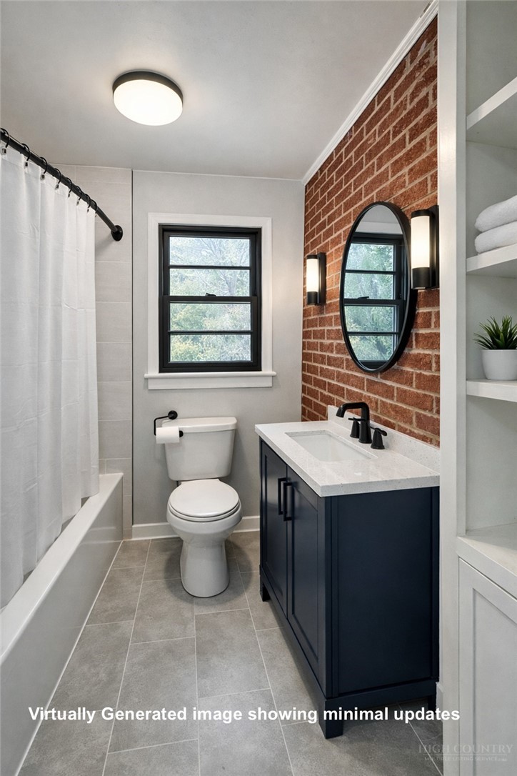 2510 Rich Hill Road Creston, NC 28615 - Photo 25 of 38 a bathroom with a sink a toilet and a mirror