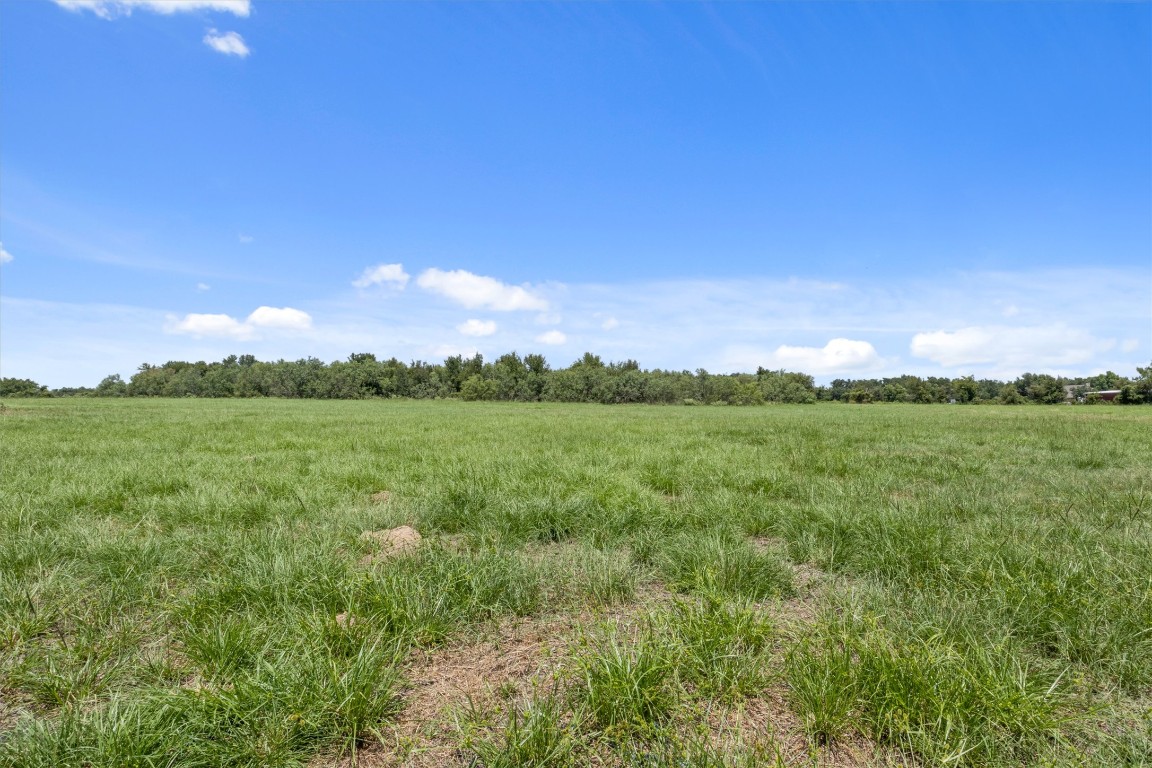 451 Pleasant Grove Road Elgin, TX 78621 - Photo 22 of 26 a view of a city with lush green forest