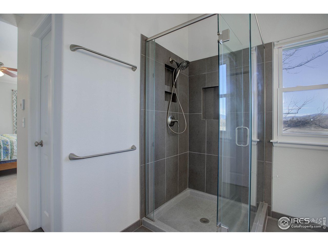 1244 Lambert Circle Lafayette, CO 80026 - Photo 25 of 39 a bathroom with a shower and a glass door