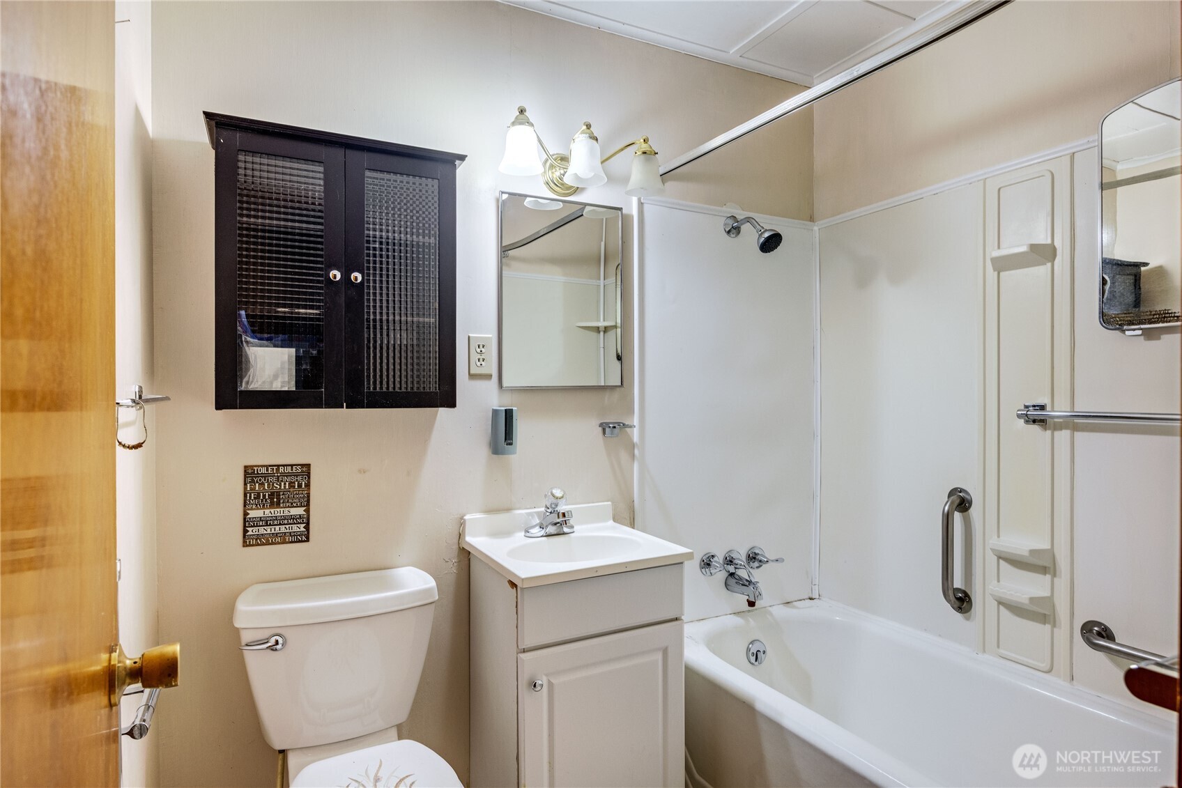 2703 Anderson Hill Road Southwest Port Orchard, WA 98367 - Photo 16 of 27 a bathroom with a toilet sink and mirror