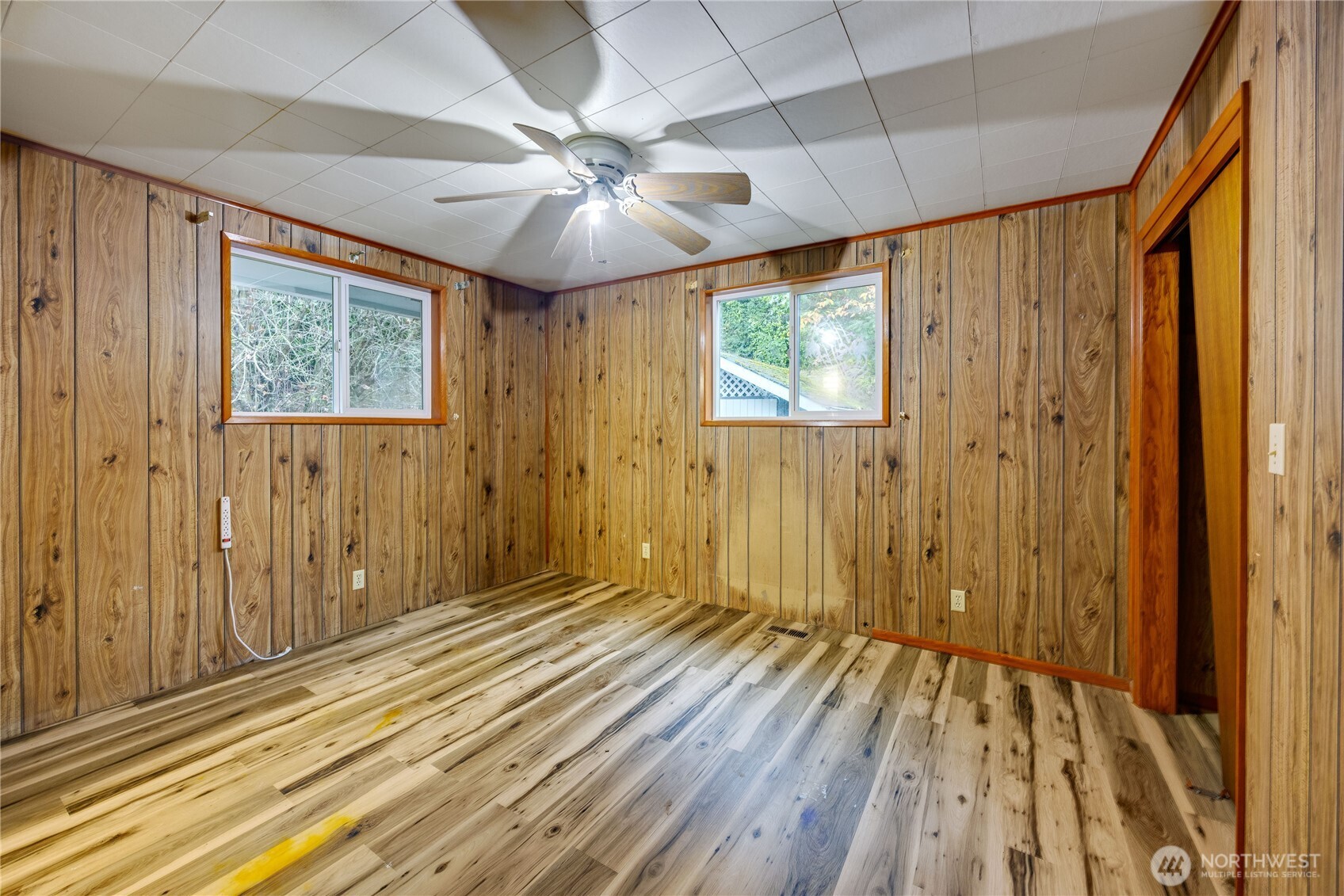 2703 Anderson Hill Road Southwest Port Orchard, WA 98367 - Photo 20 of 27 wooden floor in an empty room with a window