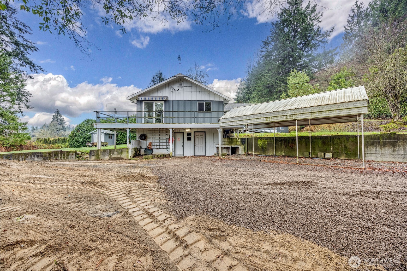 2703 Anderson Hill Road Southwest Port Orchard, WA 98367 - Photo 2 of 27 a front view of a house with garden