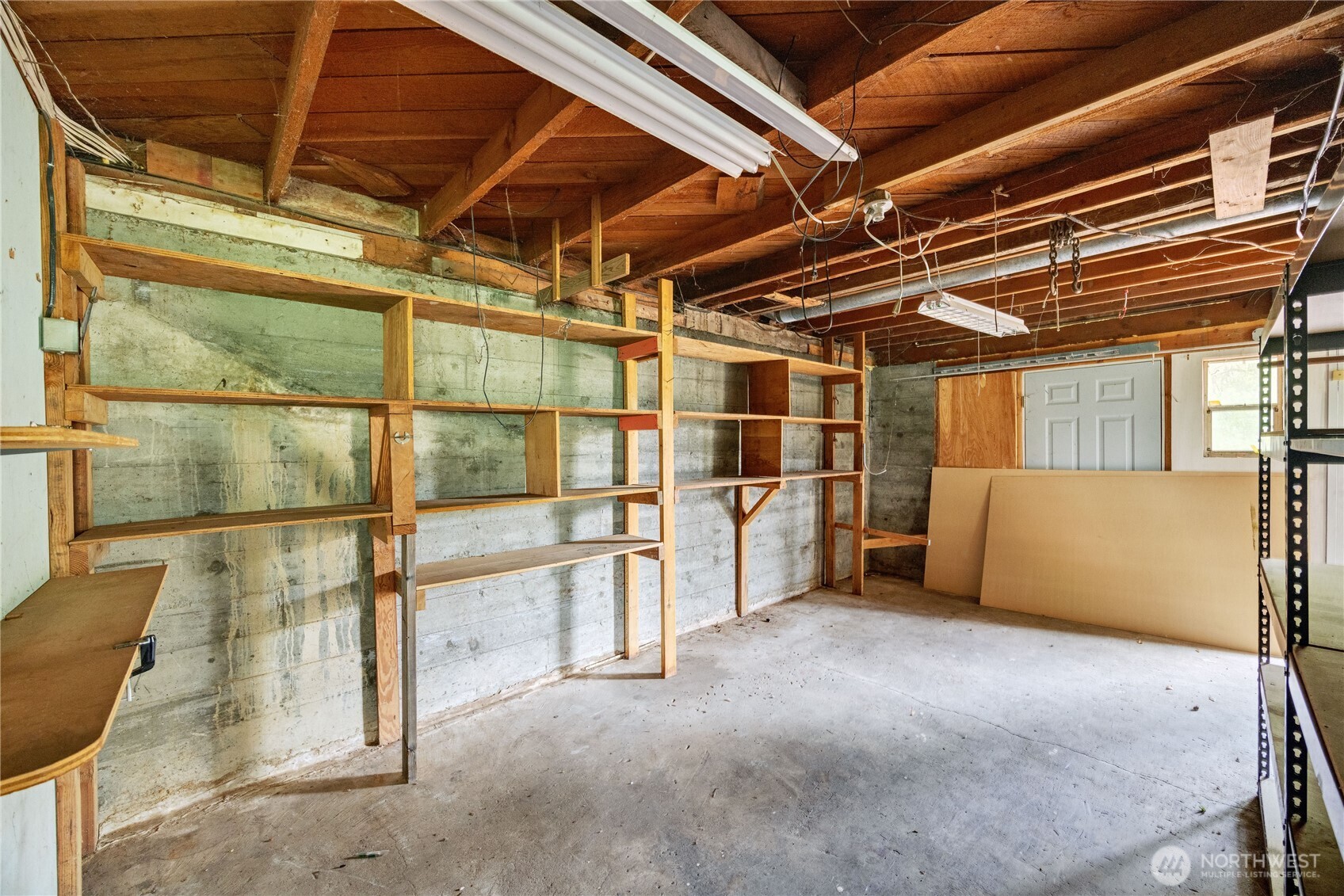 2703 Anderson Hill Road Southwest Port Orchard, WA 98367 - Photo 6 of 27 a view of an empty room with wooden floor