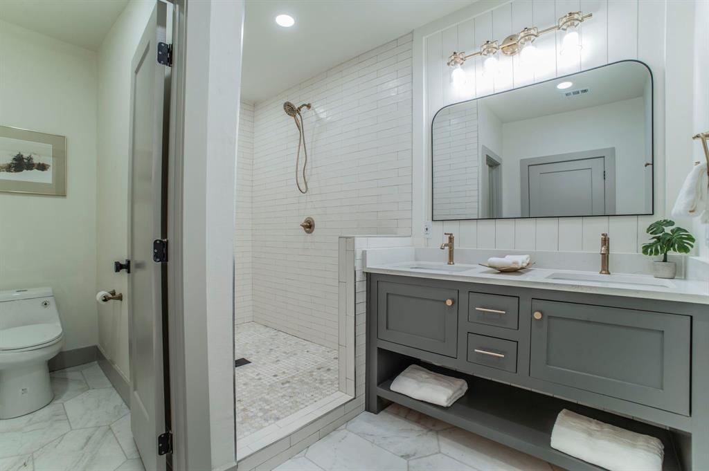 5914 Victor Street Dallas, TX 75214 - Photo 15 of 32 a bathroom with a sink and a mirror
