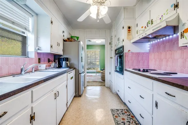 a large kitchen with a large window