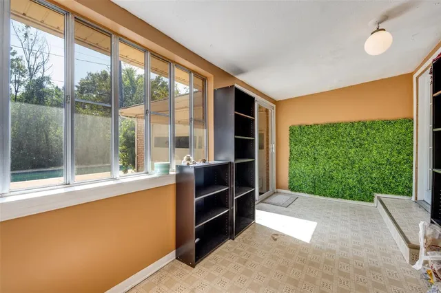 a view of a room with a large window