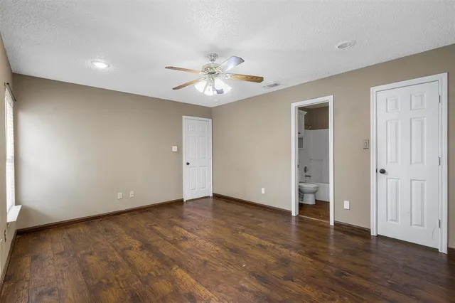 a bathroom with a sink toilet a mirror and shower