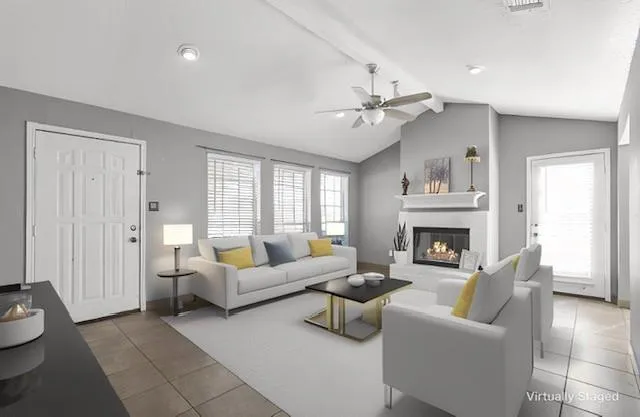 a living room with furniture and a fireplace