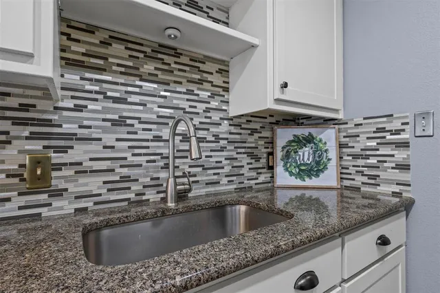 a kitchen with a stove and a microwave