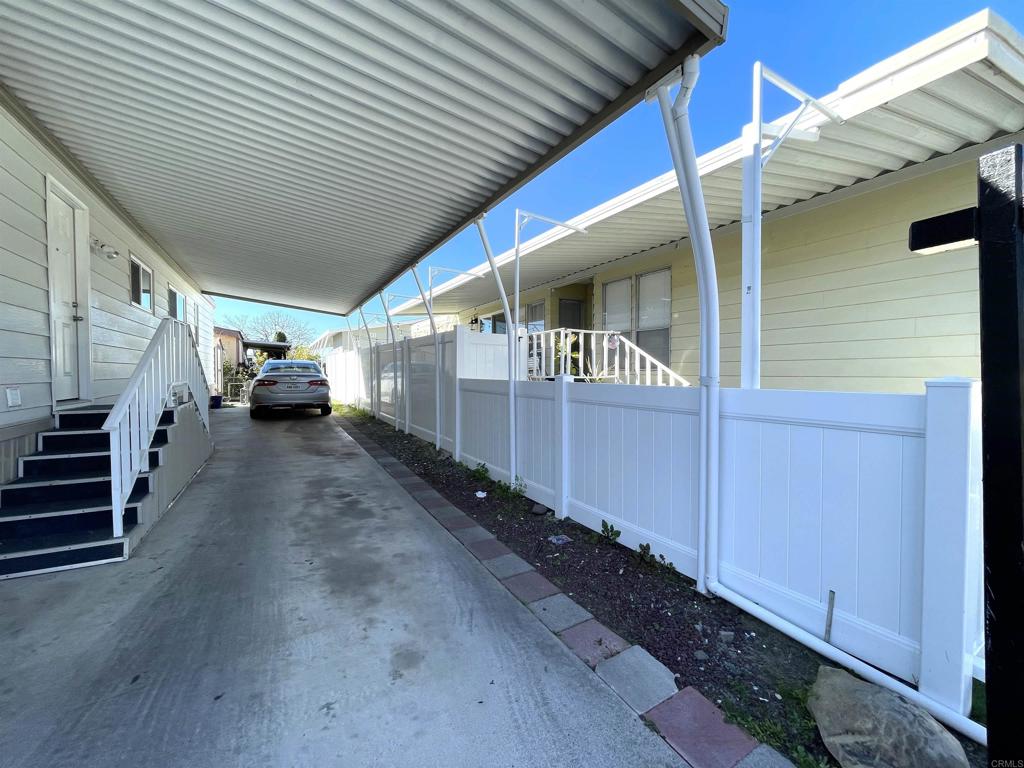 4660 North River Road, Unit 95 Oceanside, CA 92057 - Photo 22 of 37 a view of a house with a car park side of road