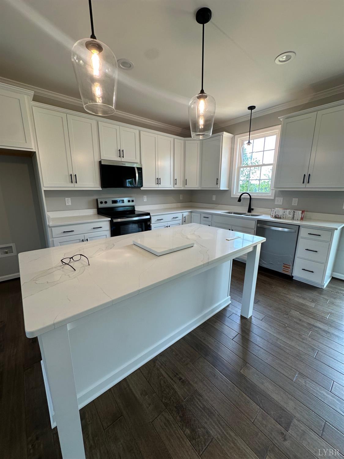 1493 Buck Crk Road Appomattox, VA 24522 - Photo 12 of 18 a kitchen with a stove a sink and a refrigerator