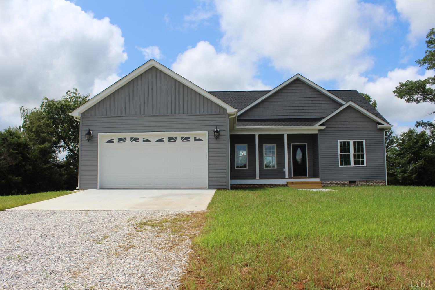 1493 Buck Crk Road Appomattox, VA 24522 - Photo 3 of 18 a front view of a house with yard and garage