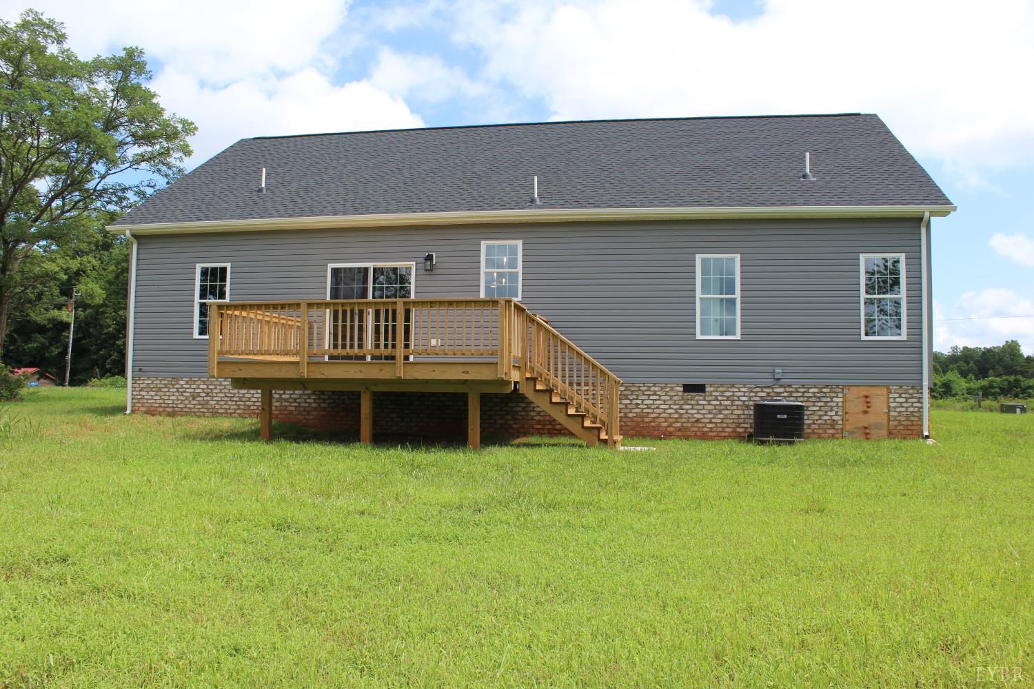 1493 Buck Crk Road Appomattox, VA 24522 - Photo 4 of 18 a front view of a house with a yard