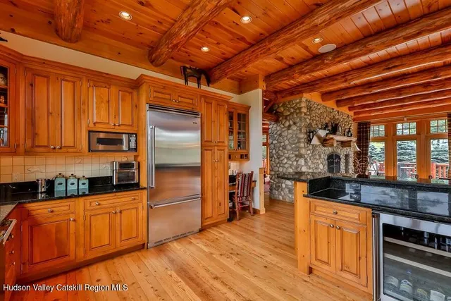 a bedroom with a bunk bed and a window