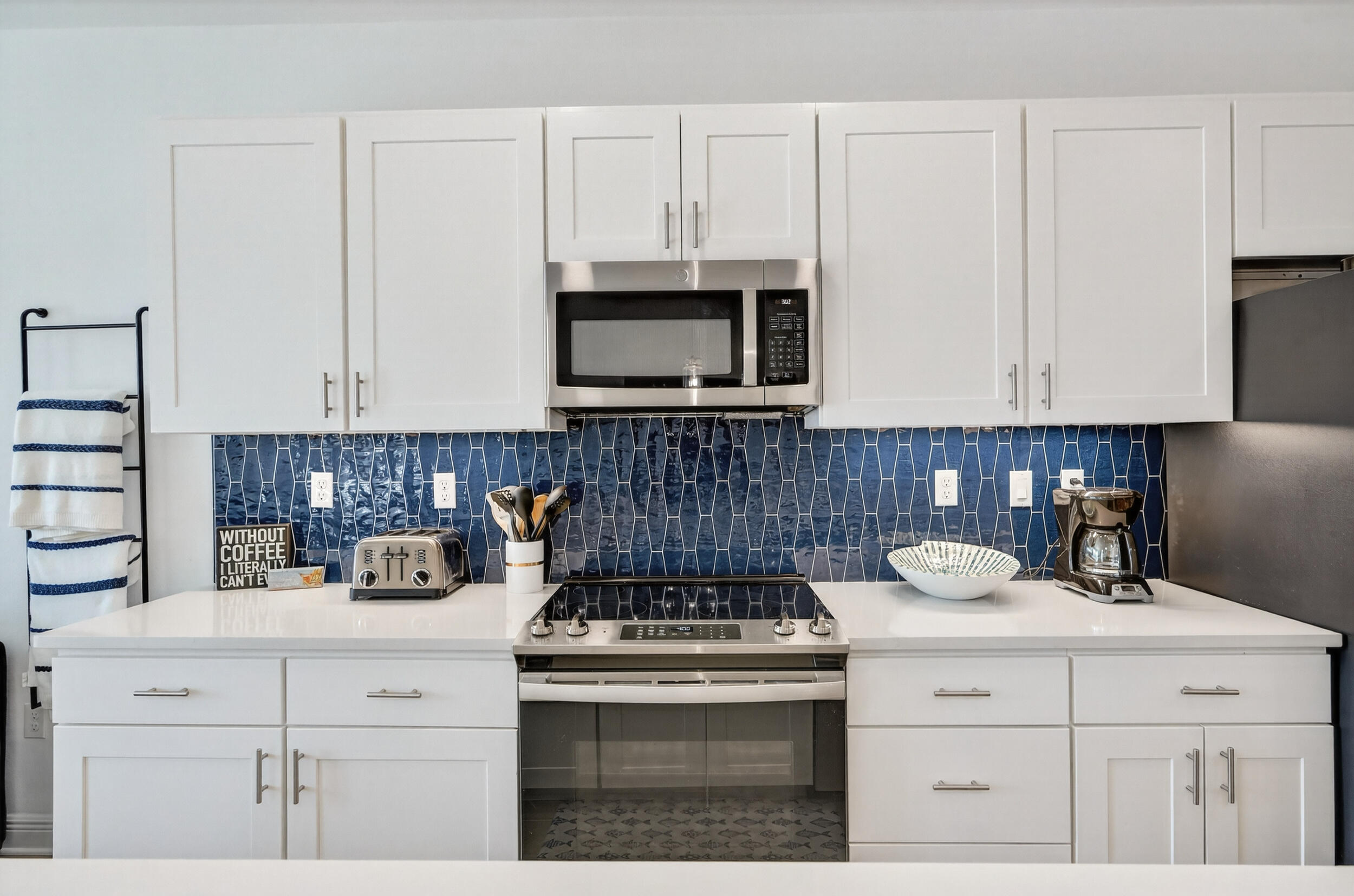 1740 South Co Highway 393, Unit 103 Santa Rosa Beach, FL 32459 - Photo 14 of 73 a kitchen with appliances a sink and cabinets