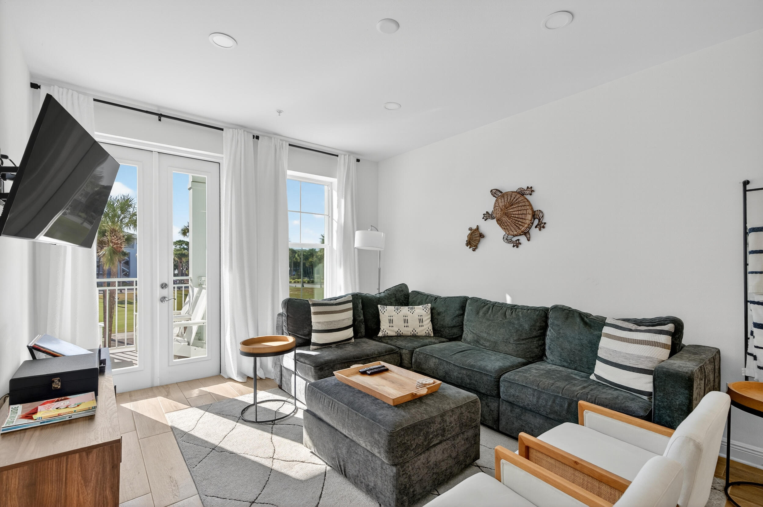 1740 South Co Highway 393, Unit 103 Santa Rosa Beach, FL 32459 - Photo 17 of 73 a living room with furniture and a flat screen tv
