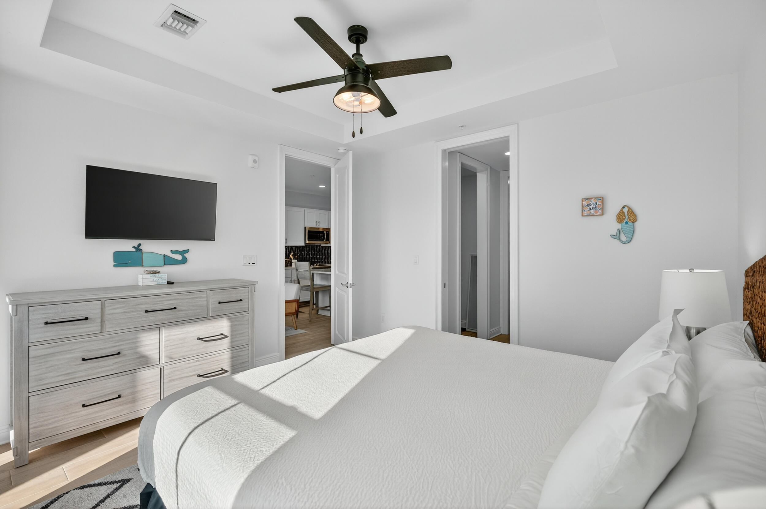 1740 South Co Highway 393, Unit 103 Santa Rosa Beach, FL 32459 - Photo 23 of 73 a bedroom with a bed and a flat screen tv