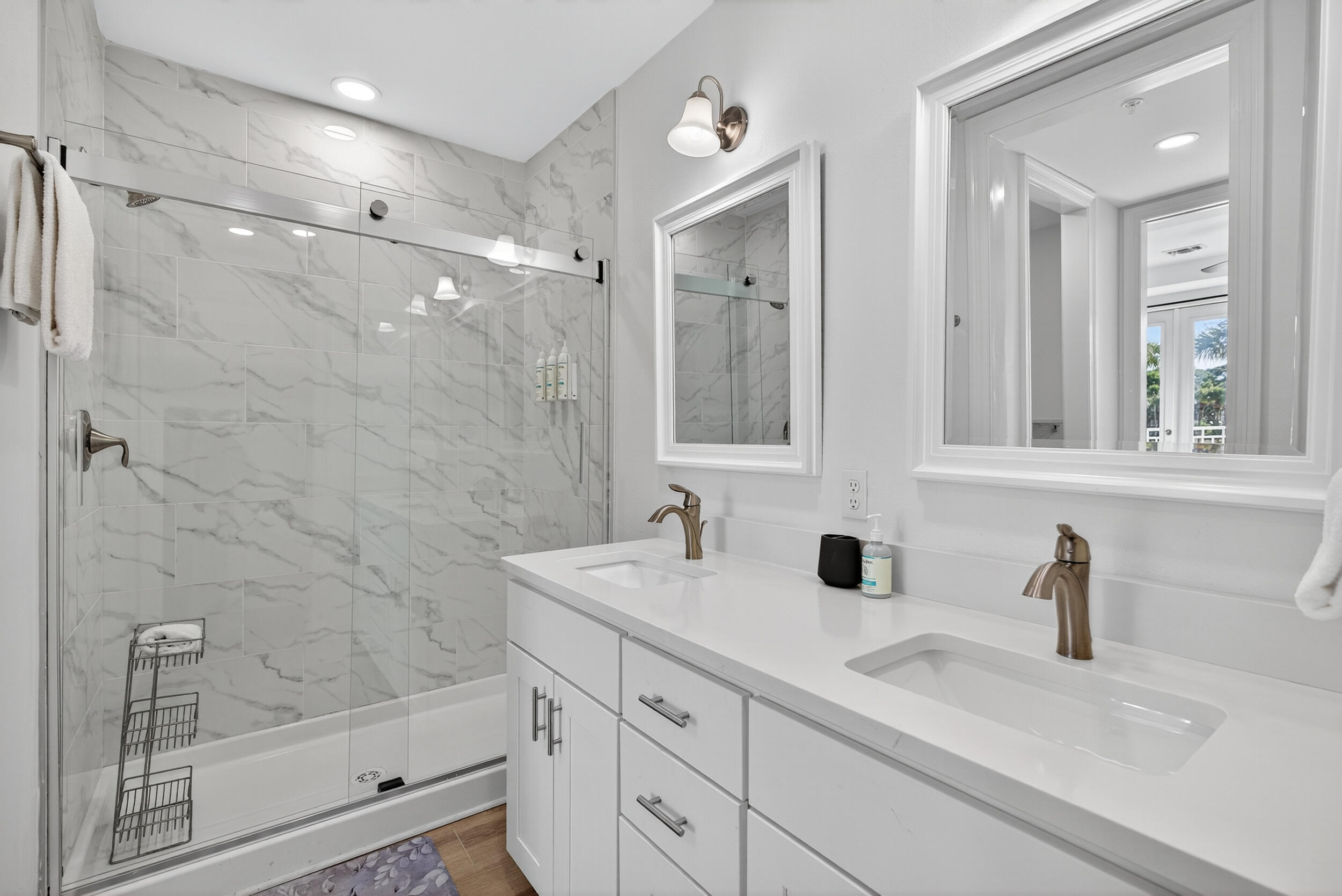 1740 South Co Highway 393, Unit 103 Santa Rosa Beach, FL 32459 - Photo 25 of 73 a bathroom with a shower sink and mirror