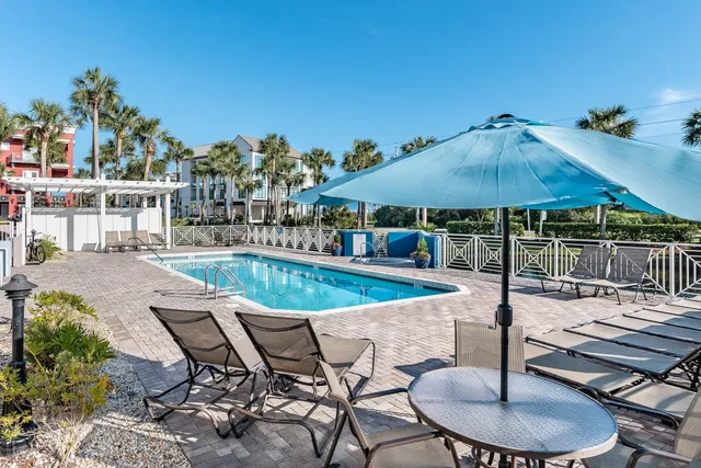 an aerial view of residential houses with outdoor space and street view
