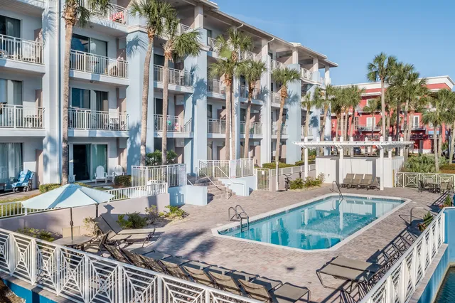 a bedroom with a bed a desk and chair