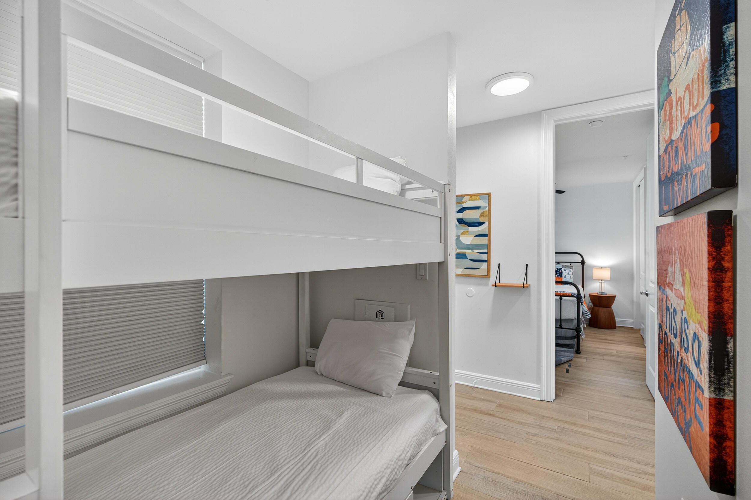 1740 South Co Highway 393, Unit 103 Santa Rosa Beach, FL 32459 - Photo 5 of 73 a bedroom with a bed and a flat tv screen on wall