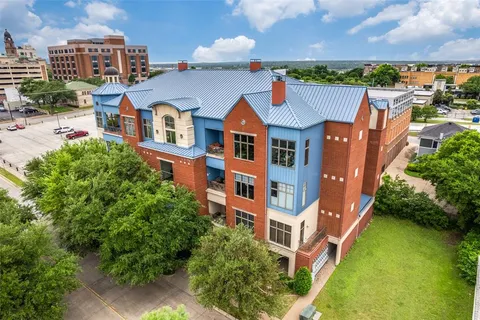an aerial view of a house with a garden