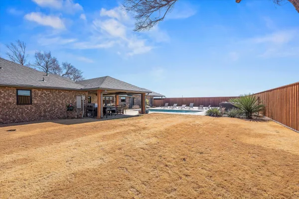 a view of a livingroom with furniture and a flat screen tv