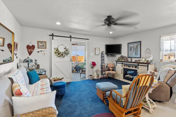 a very nice looking living room with a large window