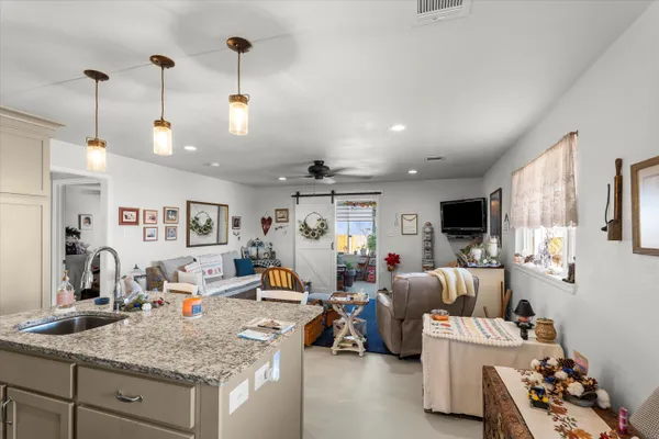 a bedroom with furniture and a chandelier