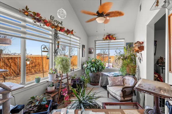 a bathroom with a granite countertop sink a toilet a mirror and shower