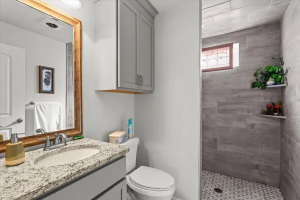 a view of a storage & utility room with dryer and washer