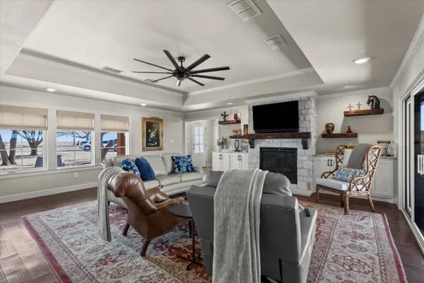 a kitchen with stainless steel appliances a dining table chairs stove and refrigerator