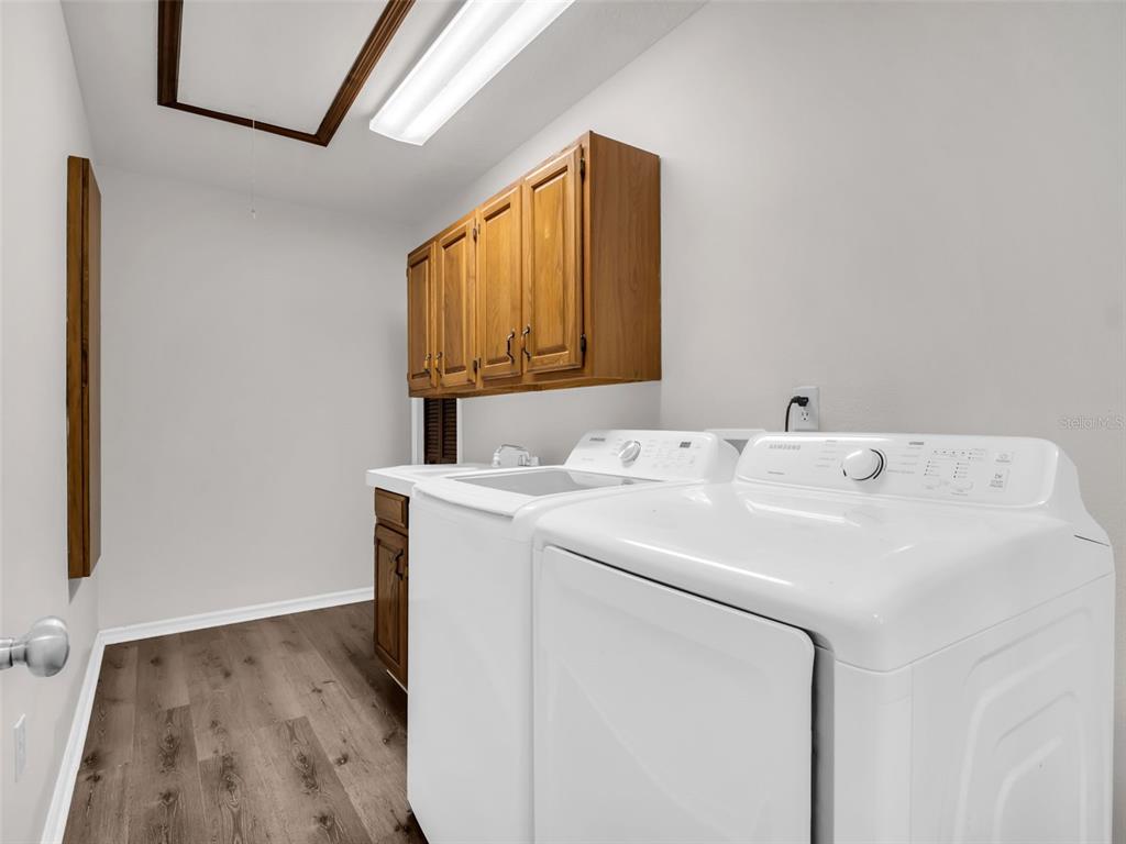 6241 Bayside Drive New Port Richey, FL 34652 - Photo 34 of 78 a utility room with dryer and washer