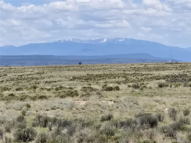 a view of a large body of water and mountain