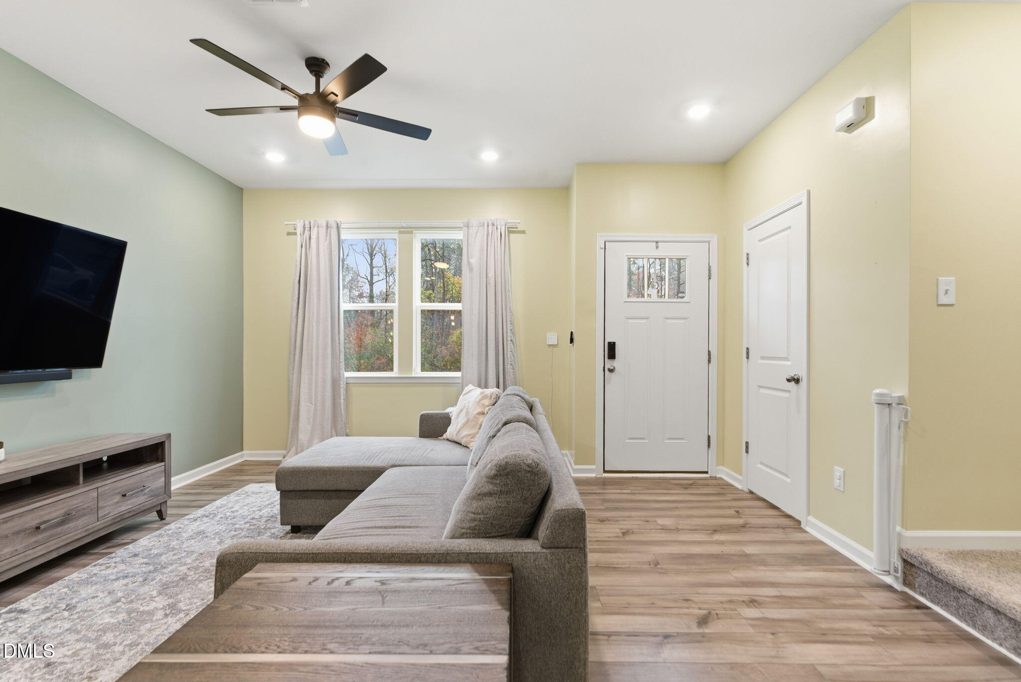 449 Hacksaw Trail Raleigh, NC 27610 - Photo 7 of 36 a living room with furniture and a flat screen tv